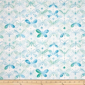 May include: A white fabric with a repeating pattern of blue and green butterflies. The butterflies are outlined in black and have a watercolor effect.
