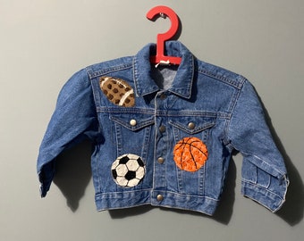 90s vintage denim jacket kids blue jean coat made in the USA 2T toddler football soccer ball basketball baseball patches xs sportswear