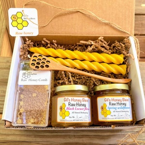Honeycomb gift box with raw honey, pure beeswax candles, wooden honey dipper