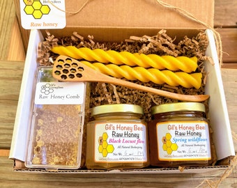 Honeycomb gift box with raw honey, pure beeswax candles, wooden honey dipper