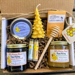 Honey gift basket. Raw honey, 100% beeswax candle, handcrafted lip balm, skin salve, honey dipper, and pollinators wildflowers mix Christmas tree