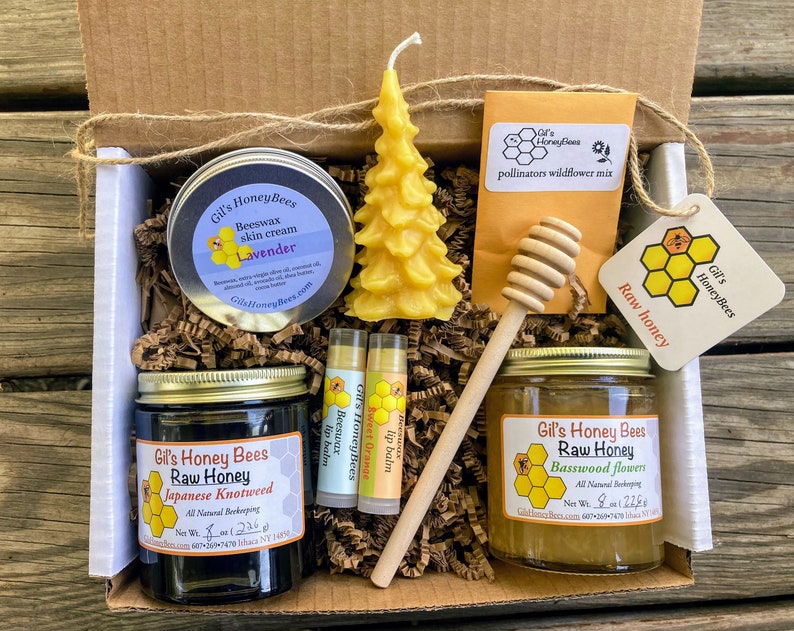 Honey gift basket. Raw honey, 100% beeswax candle, handcrafted lip balm, skin salve, honey dipper, and pollinators wildflowers mix Christmas tree