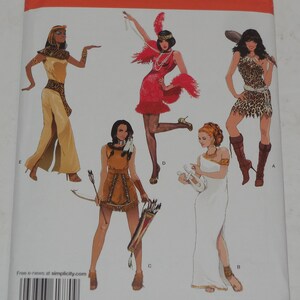 May include: Simplicity sewing pattern number 1770 P5 for five different costumes. The costumes include a Native American, a Greek goddess, a flapper, a jungle girl, and an Egyptian. The pattern is for sizes US 12-20, Euro 38-46, and French 40-48.
