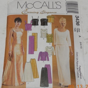 May include: Sewing pattern for a dress and skirt. The pattern is for sizes 6-8-10. The pattern includes a long skirt, a short skirt, a top, and a bodice. The pattern is from McCall's Evening Elegance line.