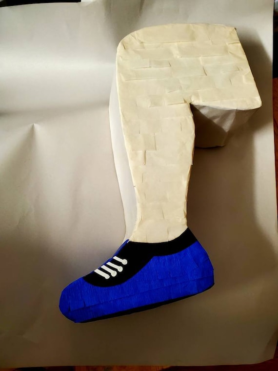 Runner pinata, leg pinata. "Break your leg" party