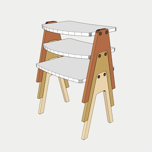 May include: A three-tiered wooden shelf unit with a light gray surface and a multi-toned wood frame. The frame features a combination of light and dark brown wood, with a natural wood finish on the legs. The shelves are approximately 12 inches wide.