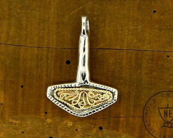 May include: Silver pendant with a gold-colored Mjolnir hammer design. The pendant has a loop at the top for attaching to a chain.