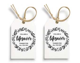 May include: Two printable gift tags with a floral wreath design and the text "You are a lifesaver. Thanks for all you do!"