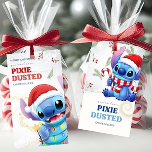 May include: Two clear cellophane treat bags filled with red and white peppermint sweets, each tied with a red ribbon and a rectangular tag. The tags feature the character Stitch wearing a Santa hat, with the text Merry Christmas, Pixie Dusted, and Chloe Millers.