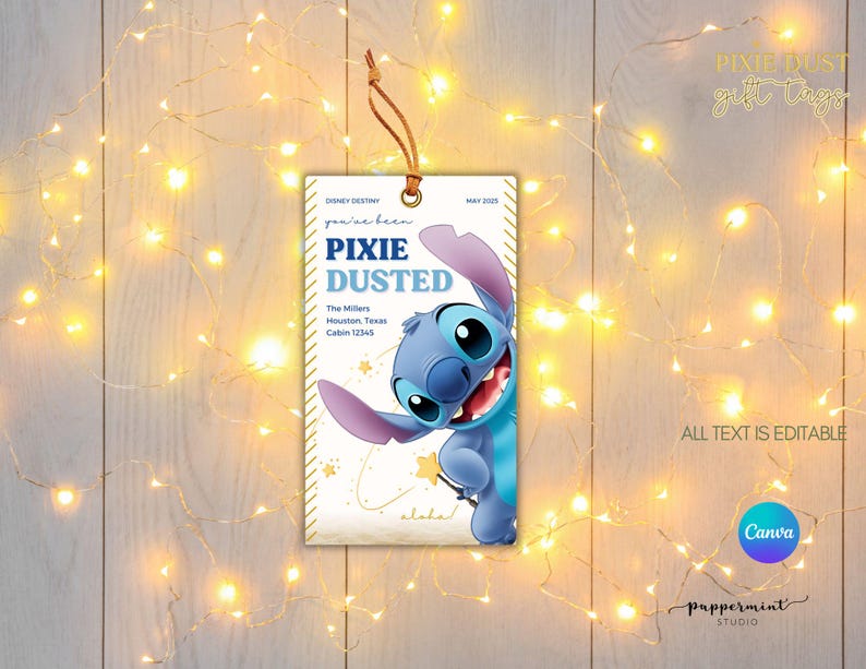 May include: A rectangular gift tag with a blue and white design featuring the character Stitch. The tag includes the text "PIXIE DUSTED" and editable text fields. A brown string is attached at the top. The background is a wooden surface with string lights.