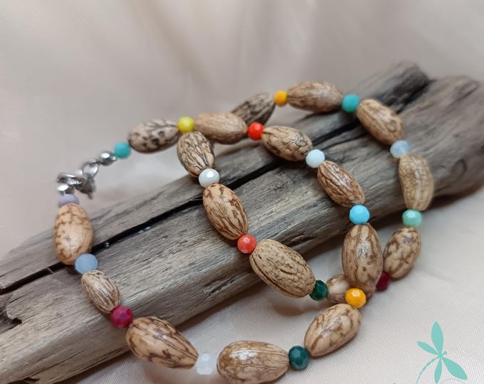 Bracelet made with olive stones and beads.