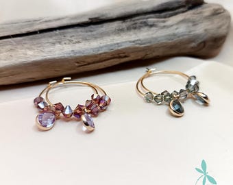 Glass crystal drop hoop earrings. Purple and black.