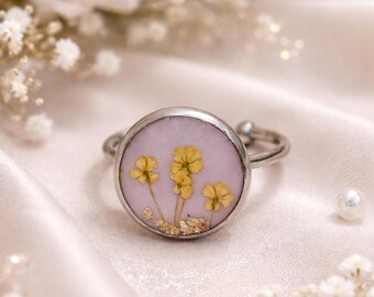 Ring with real flowers embedded in resin.