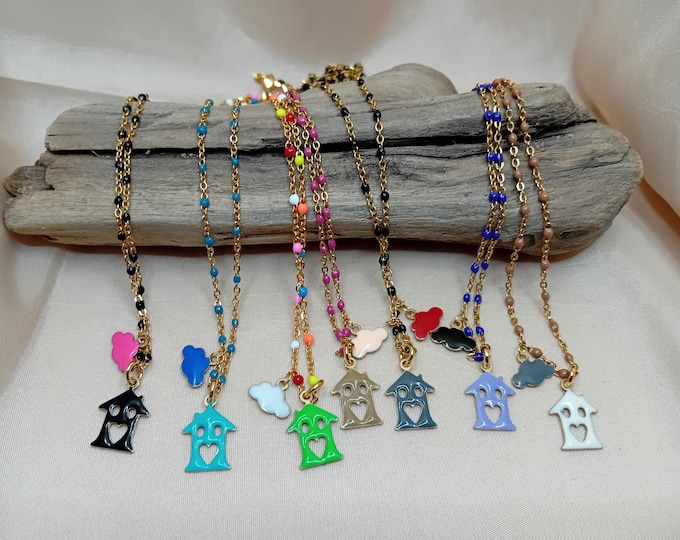 Gold-plated steel necklace with house and cloud pendants.