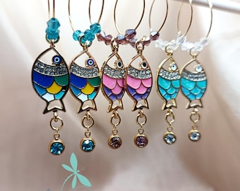 Hoop earrings with fish and crystals.