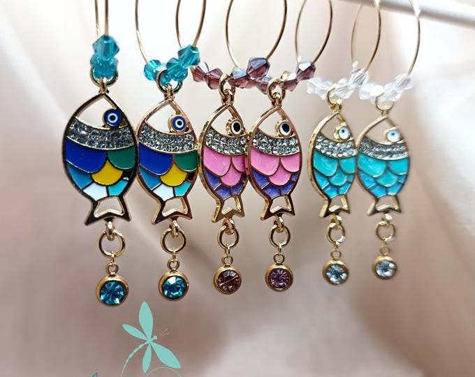 Hoop earrings with fish and crystals.