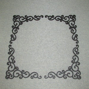 May include: A black decorative frame with a scroll design. The frame is made of a thin, lightweight material and has a simple, elegant design.