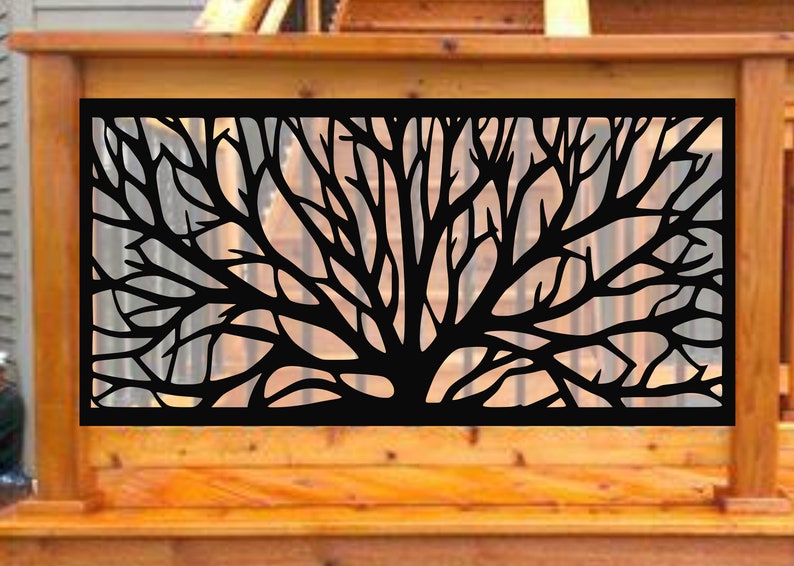 May include: Black metal decorative panel featuring a tree branch design. The panel is rectangular and is set against a wooden deck railing. The tree branches are intricately cut out, creating a silhouette.