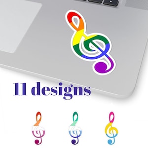 Könnte beinhalten: Ein farbenfroher Aufkleber mit einem Violinschlüssel-Design in Regenbogenfarben, platziert auf einem Laptop. Der Aufkleber hat einen weißen Rand. Unter dem Aufkleber steht der Text "11 designs". Weitere Violinschlüssel-Designs sind abgebildet.