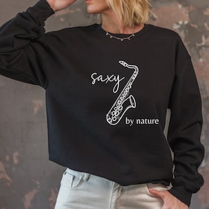 Saxy by nature sweatshirt, funny saxophone band humor crewneck sweater, music teacher and student cotton shirt, gift for sax player
