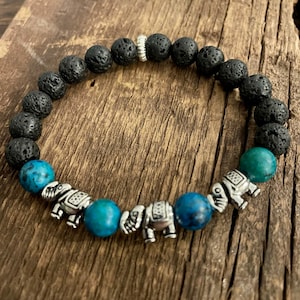 TheBlingStore Natural Healing Aromatherapy Lava Rock Beads Essential Oil Diffusing Bracelet with a Tassel Black with Flower Earth and Sky Color Beads TheBlingStore Natural Healing Aromatherapy Lava Rock Beads Essential Oil Diffusing Bracelet with a Tassel Black with Flower Earth and Sky Color Beads