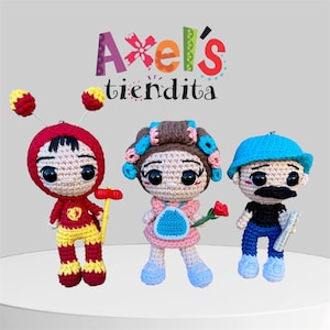 May include: Three handmade crochet dolls. The first doll is wearing a red hooded outfit with yellow accents and antennae. The second doll is in a pink dress with blue accents and curlers. The third doll is wearing a blue hat and has a mustache. The text "Axel's tiendita" is above the dolls.