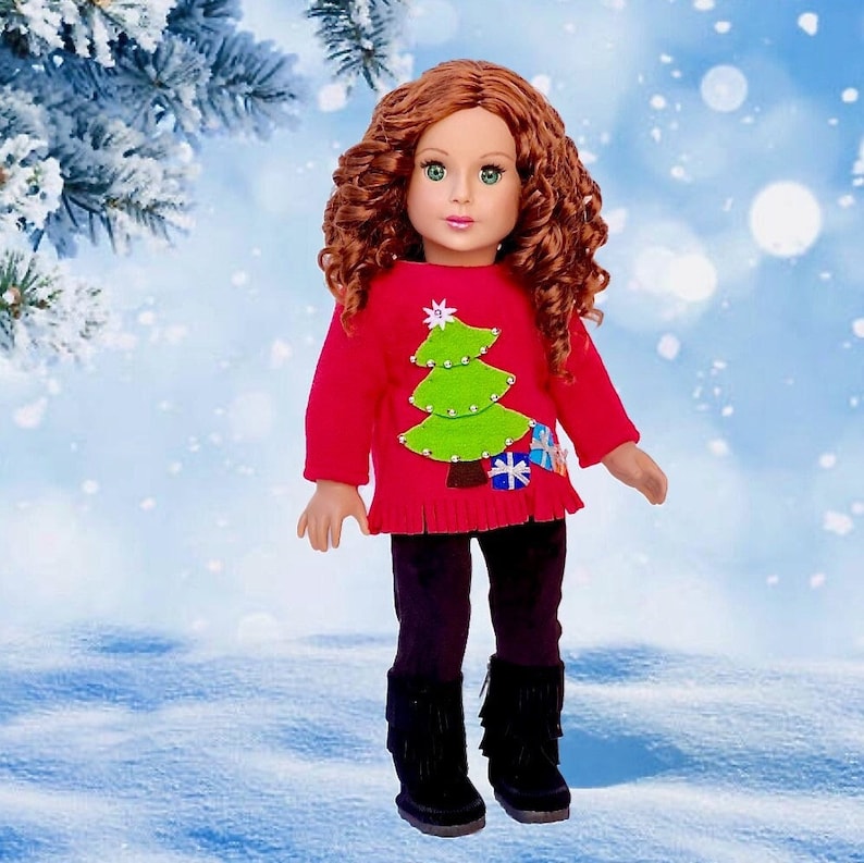3 piece outfit for 18 inch doll.  Red fleece sweater decorated with christmas tree and ornaments with black velvet leggings and black fringe boots.