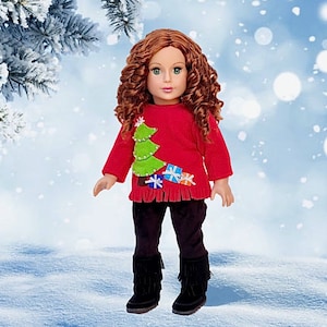 May include: A red Christmas sweater with a green Christmas tree and presents on it. The sweater is being worn by a doll with long, curly red hair. The doll is wearing black pants and black boots.