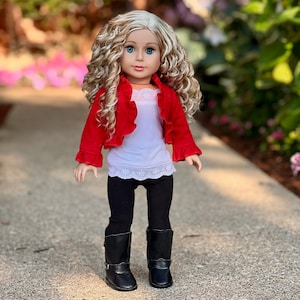 May include: A doll with blonde curly hair wearing a red ruffled jacket, a white tank top with lace trim, black leggings, and black boots.