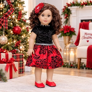 May include: A doll with long brown curly hair and a red flower hair accessory. The doll wears a black velvet short-sleeved top with a silver-beaded neckline and waist, paired with a red skirt featuring a black floral pattern and red flat shoes.
