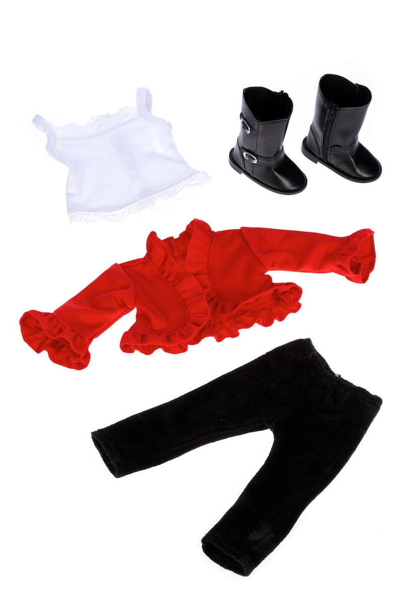May include: A doll outfit set with a red ruffled jacket, black pants, a white lace tank top, and black boots.
