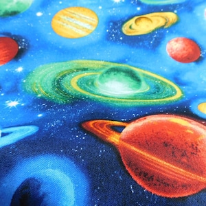 Bright Space on Blue-Fabric is sold by the half yard, one continuous cut