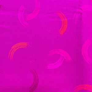May include: Bright magenta fabric with a repeating pattern of curved brushstrokes in shades of pink and orange. The fabric has a subtle texture, and the brushstrokes are evenly spaced across the surface.