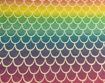 May include: Rainbow mermaid scale fabric with a white outline. The fabric has a gradient of colors from red to yellow to green to blue to purple.