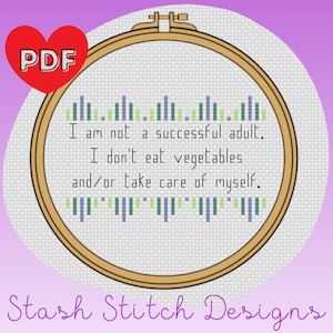 May include: A cross-stitch pattern featuring the text "I am not a successful adult. I don't eat vegetables and/or take care of myself." The pattern is in a white hoop with a brown wooden frame. The text is in green, blue, and yellow thread. The background is a light purple color. The image also includes the text "PDF" in a red heart and "Stash Stitch Designs" in a black font.