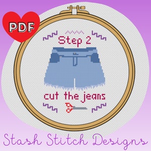 May include: Cross-stitch design in a wooden hoop featuring a pair of blue jean shorts. The text "Step 2" and "cut the jeans" are above and below the shorts. A red heart with "PDF" is in the upper left corner. The words "Stash Stitch Designs" are at the bottom.