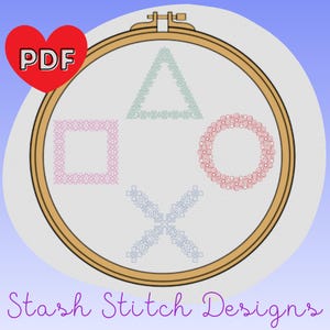 May include: A cross-stitch design featuring the PlayStation controller symbols: a green triangle, a pink square, a red circle, and a blue X. The design is in a wooden embroidery hoop, with the text "Stash Stitch Designs" below.