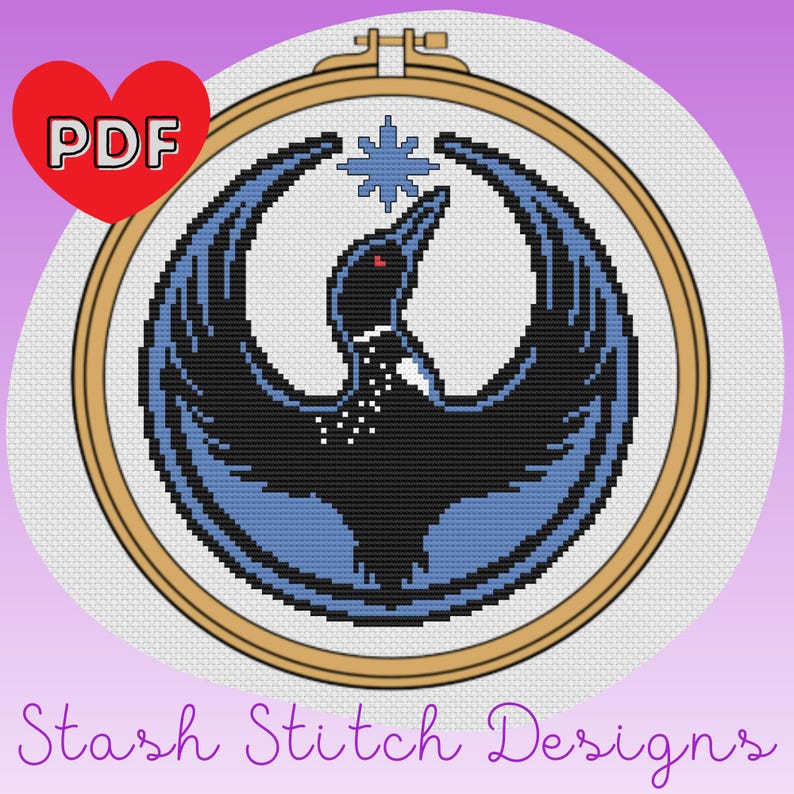 May include: Cross-stitch pattern featuring a stylized bird design in black and blue, with a star above. The design is set within a wooden embroidery hoop. A red heart with "PDF" is in the upper left corner. The text "Stash Stitch Designs" is at the bottom.