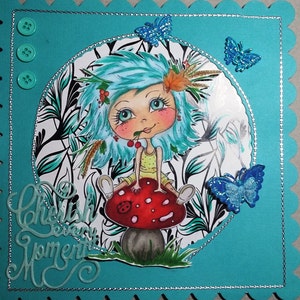 May include: A whimsical illustration of a blue-haired girl sitting on a red and white mushroom with the text "Cherish Every Moment" in green lettering.