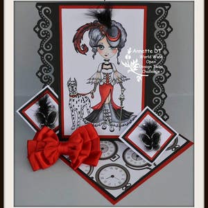 May include: A pop-up card with a black and white illustration of a woman in a red dress and a dog. The card is decorated with red and black accents and features a red bow. The text "Created by Annette" and "Annette DT World Wide Open Design Team Challenge" is visible on the card.