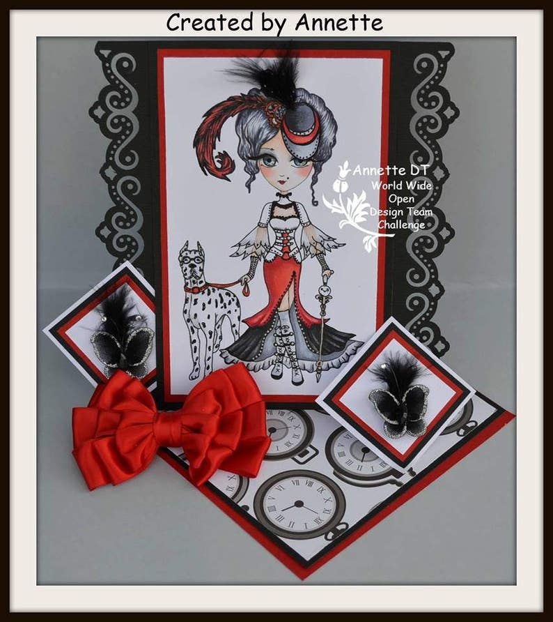 May include: A pop-up card with a black and white illustration of a woman in a red dress and a dog. The card is decorated with red and black accents and features a red bow. The text "Created by Annette" and "Annette DT World Wide Open Design Team Challenge" is visible on the card.