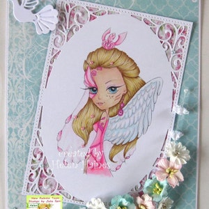 May include: A white card with a decorative border and a pink and white illustration of a fairy with wings. The card has the text "created by Helen Haines" at the bottom.