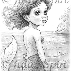 May include: A pencil sketch of a mermaid with flowing hair and a scaled tail, standing in the ocean. The mermaid is looking over her shoulder with a serene expression. The image is signed "© Julia Spiri".