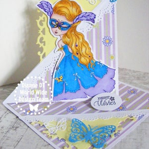 May include: A handmade card with a purple, blue, and yellow color scheme. The card features a masked girl with long blonde hair, butterflies, and the text "Best Wishes".
