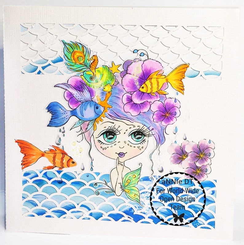 May include: A whimsical illustration of a mermaid with purple hair, surrounded by colorful fish, flowers, and a peacock feather. The mermaid is wearing a seashell necklace and has a seashell crown. The background is a blue and white watercolor pattern.
