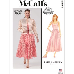 May include: Vintage McCall's sewing pattern for a dress and jacket. The dress is a gingham print with a sweetheart neckline and pockets. The jacket is a cream color with a polka dot print. The pattern is labeled "Vintage 80's" and "Laura Ashley since 1953".
