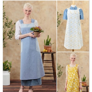 May include: Simplicity sewing pattern S3257. The image shows three apron designs: a denim apron with pockets, a white apron with a blue floral pattern, and a yellow apron with a white floral pattern. The aprons are displayed on models. The text "easy-to-sew" is visible.
