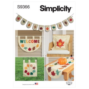 May include: Simplicity pattern featuring autumn-themed home decor. Includes a banner, welcome sign, pillow, garden flag, and table runner, all adorned with colorful leaf appliqués. The banner and table runner are approximately 60 inches long.