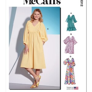 May include: A woman wearing a yellow gingham dress with a V-neck and long sleeves. The image also shows a sewing pattern with illustrations of dresses, including a green dress, a floral dress, and a purple dress. The McCall's logo is at the top.