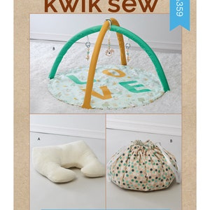 May include: A baby play mat set with a green and yellow arch, a round mat with the word "LOVE", a white support pillow, and a drawstring toy bag. The text "kwik sew" is at the top.